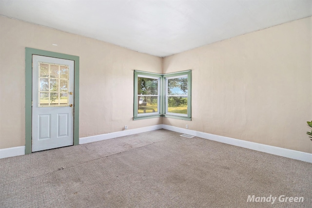 4651 E Pierce Rd, Ithaca, MI 48847 - unfurnished room with baseboards and carpet