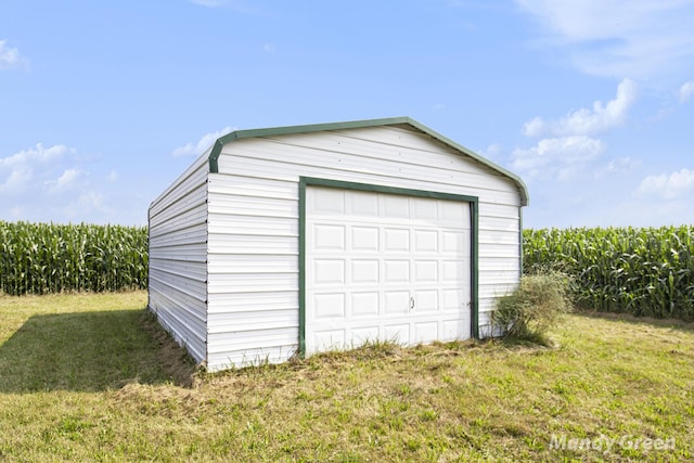 4651 E Pierce Rd, Ithaca, MI 48847 - detached garage featuring agricultural plots and a view of countryside