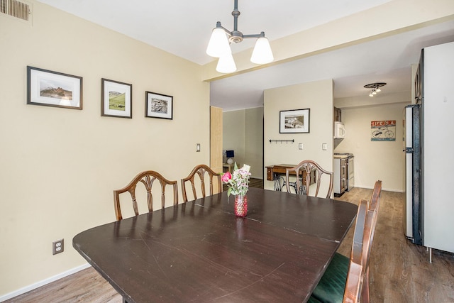 2150 Pauline Blvd Unit 203, Ann Arbor, MI 48103 - dining space with wood finished floors and baseboards