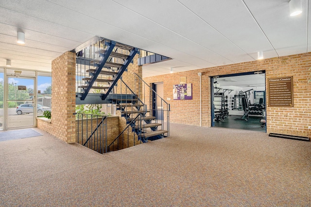 2150 Pauline Blvd Unit 203, Ann Arbor, MI 48103 - stairs with brick wall and carpet