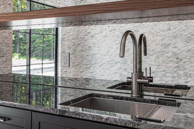 7462 Youngren Rd, Three Oaks, MI 49128 - kitchen view of a sink and gray cabinetry