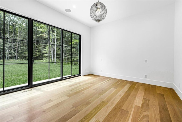 7462 Youngren Rd, Three Oaks, MI 49128 - unfurnished room with baseboards and light wood finished floors