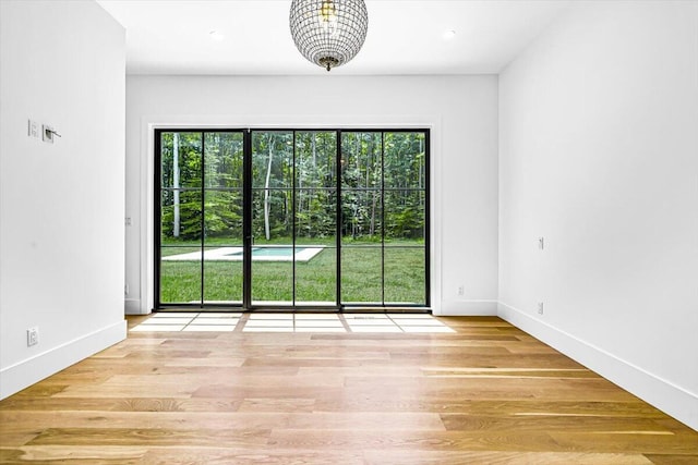 7462 Youngren Rd, Three Oaks, MI 49128 - unfurnished room with wood finished floors and recessed lighting