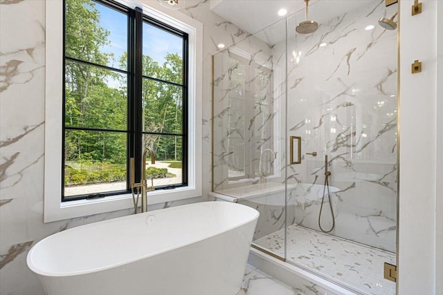 7462 Youngren Rd, Three Oaks, MI 49128 - bathroom featuring marble tiled flooring, a marble finish shower, and a freestanding tub