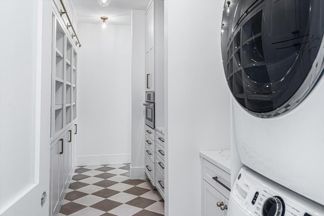 7462 Youngren Rd, Three Oaks, MI 49128 - laundry room with stacked washing machine and dryer and light floors