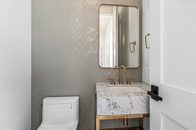 7462 Youngren Rd, Three Oaks, MI 49128 - half bathroom featuring toilet and vanity