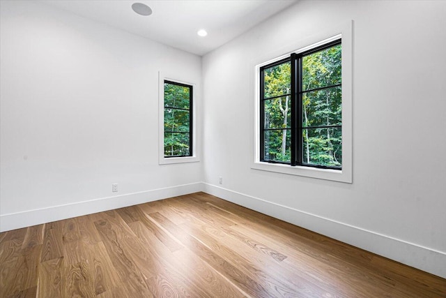 7462 Youngren Rd, Three Oaks, MI 49128 - empty room with wood finished floors and recessed lighting