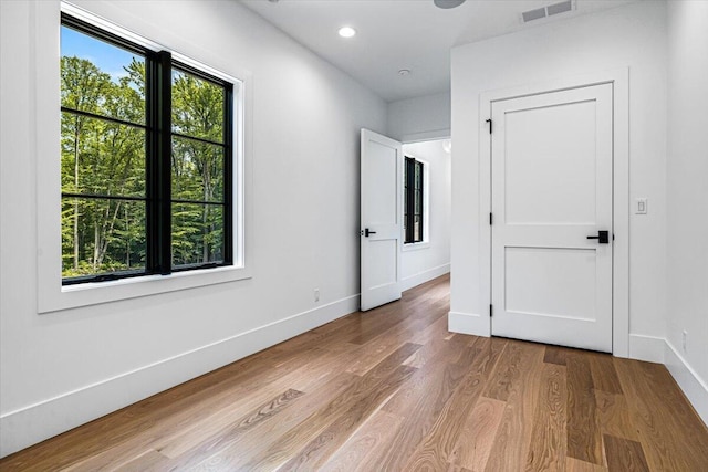 7462 Youngren Rd, Three Oaks, MI 49128 - unfurnished room featuring wood finished floors and recessed lighting