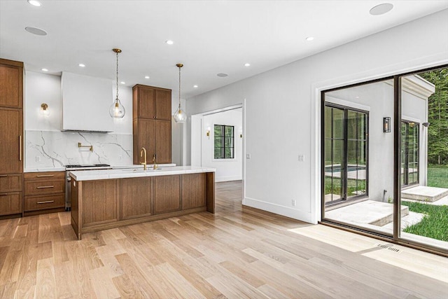 7462 Youngren Rd, Three Oaks, MI 49128 - kitchen with light countertops, plenty of natural light, backsplash, light wood-style flooring, and recessed lighting