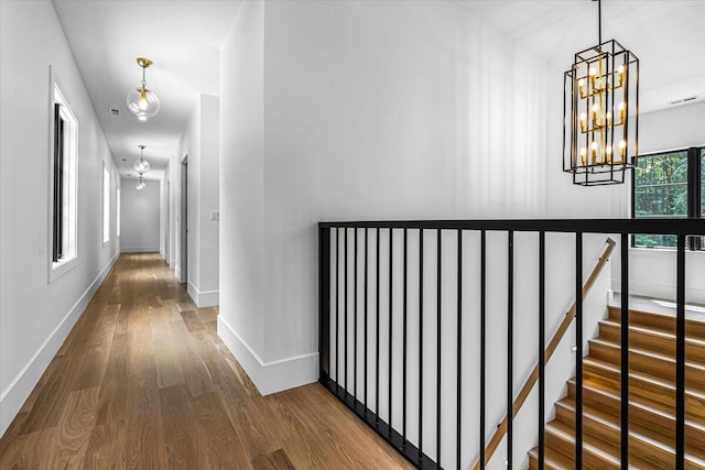 7462 Youngren Rd, Three Oaks, MI 49128 - hall featuring a chandelier and wood finished floors