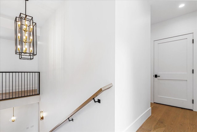 7462 Youngren Rd, Three Oaks, MI 49128 - staircase with wood finished floors, a chandelier, and recessed lighting