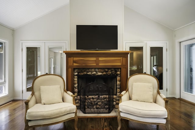 1227 Beech Dr, South Haven, MI 49090 - sitting room featuring wood finished floors, a fireplace, high vaulted ceiling, and french doors