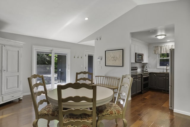1227 Beech Dr, South Haven, MI 49090 - dining room with vaulted ceiling, dark wood-style flooring, and recessed lighting