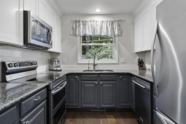 1227 Beech Dr, South Haven, MI 49090 - kitchen featuring appliances with stainless steel finishes, white cabinets, stone countertops, and recessed lighting