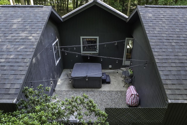 1227 Beech Dr, South Haven, MI 49090 - rear view of house featuring a hot tub, roof with shingles, and a patio