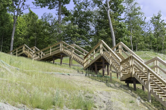 1227 Beech Dr, South Haven, MI 49090 - back of house featuring stairs and view of scattered trees