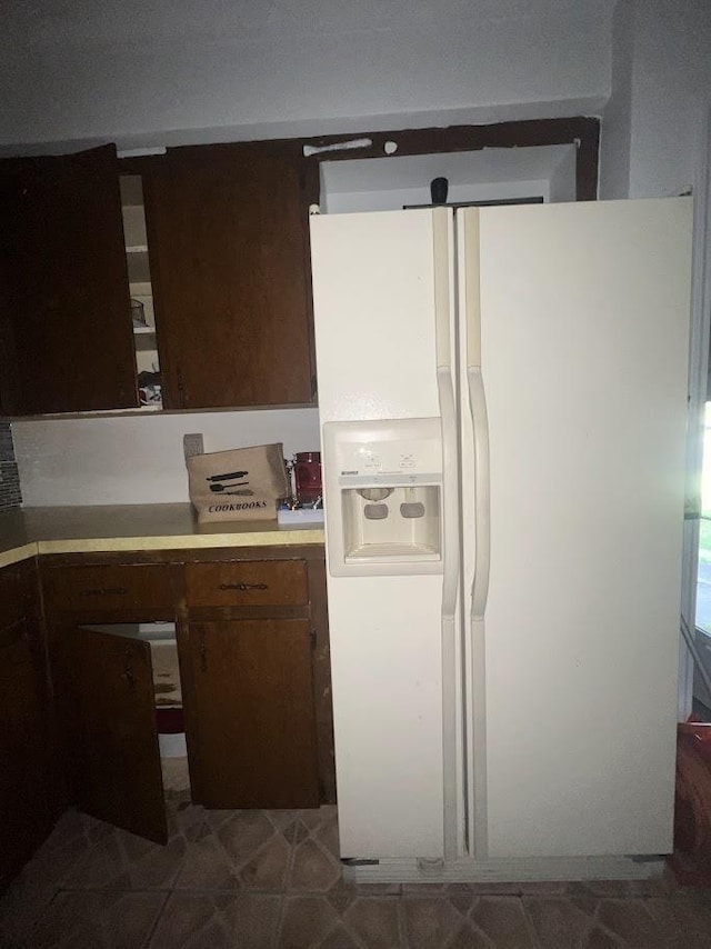 4518 Huckleberry Ln, Flint, MI 48507 - kitchen with white refrigerator with ice dispenser and light countertops