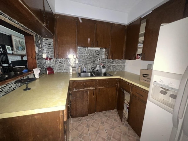4518 Huckleberry Ln, Flint, MI 48507 - kitchen featuring white fridge with ice dispenser, tasteful backsplash, light countertops, and light tile patterned floors