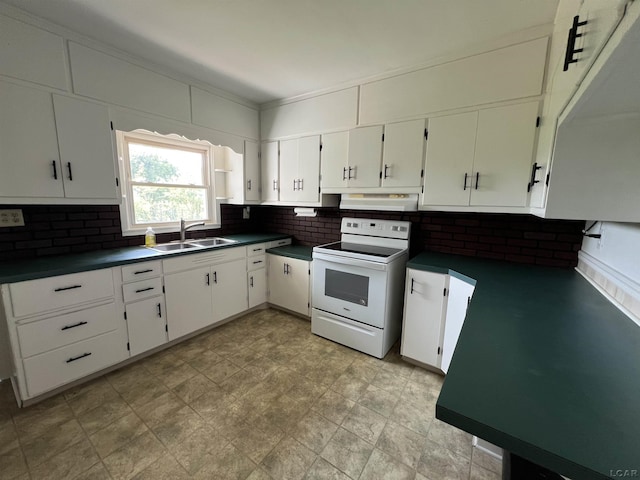 1569 N Rollin Hwy, Hudson, MI 49247 - kitchen with white electric range, dark countertops, tasteful backsplash, and white cabinets