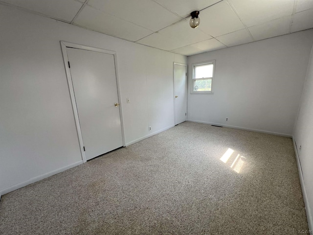 1569 N Rollin Hwy, Hudson, MI 49247 - unfurnished bedroom featuring a drop ceiling and carpet floors
