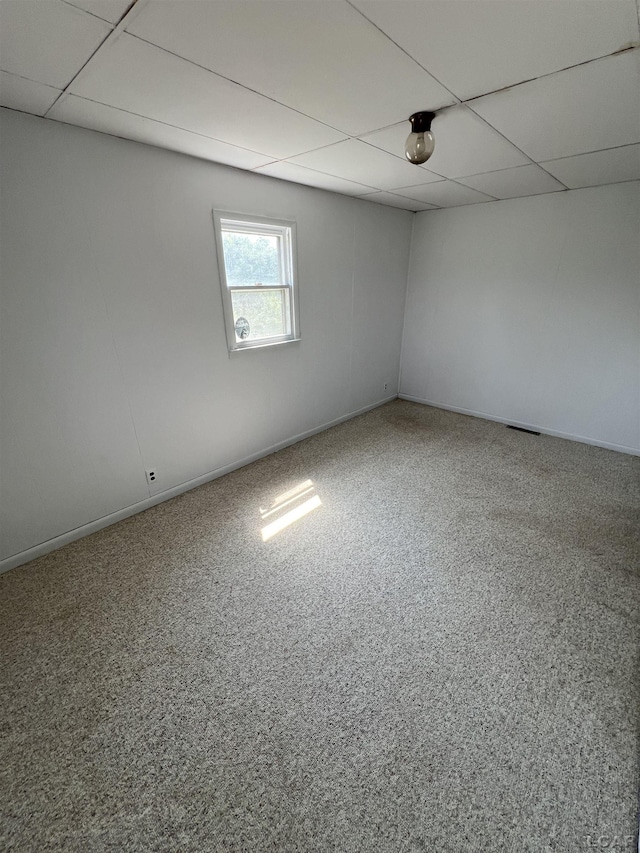 1569 N Rollin Hwy, Hudson, MI 49247 - spare room featuring a drop ceiling and baseboards