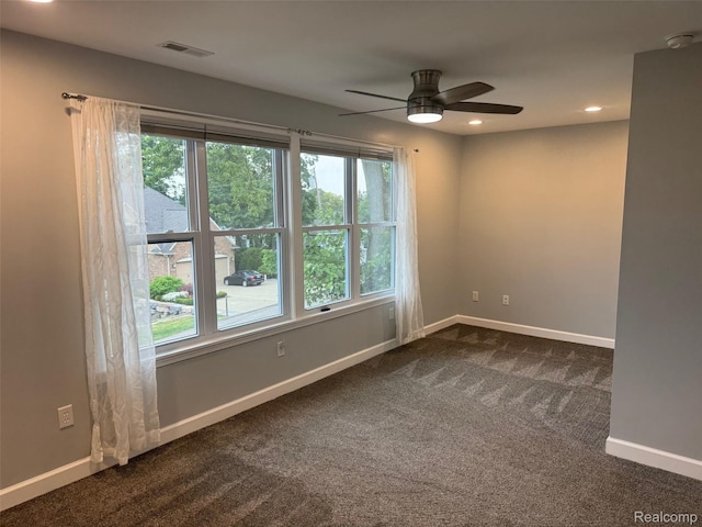 677 King Cir, Lake Orion, MI 48362 - unfurnished room with dark carpet, ceiling fan, and recessed lighting
