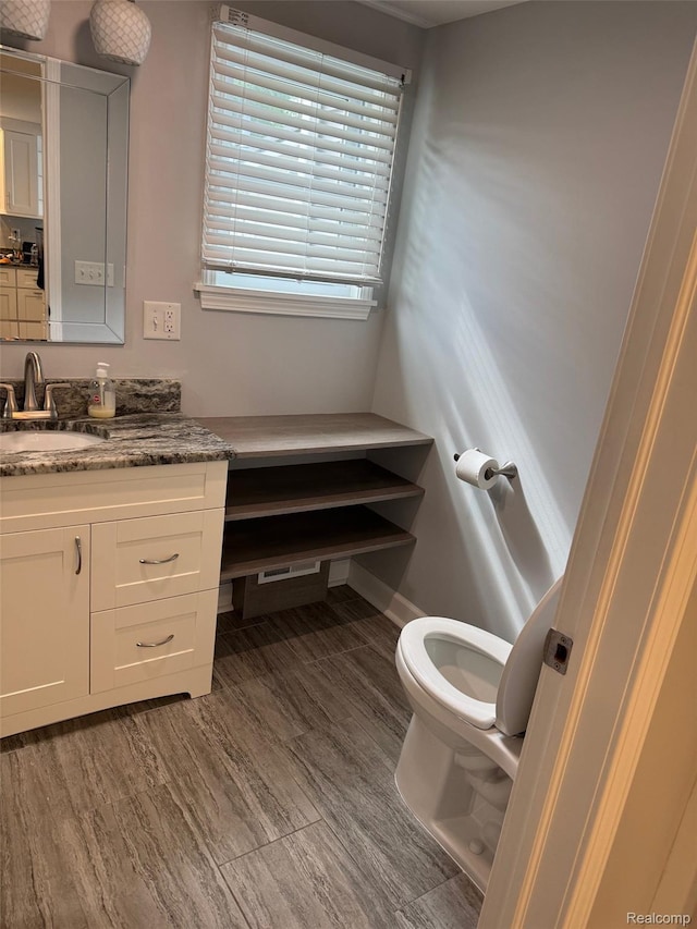677 King Cir, Lake Orion, MI 48362 - bathroom with vanity and toilet
