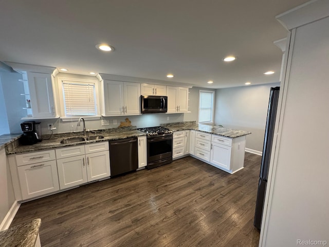 677 King Cir, Lake Orion, MI 48362 - kitchen featuring stainless steel gas stove, a peninsula, dishwasher, dark wood-type flooring, and white cabinets