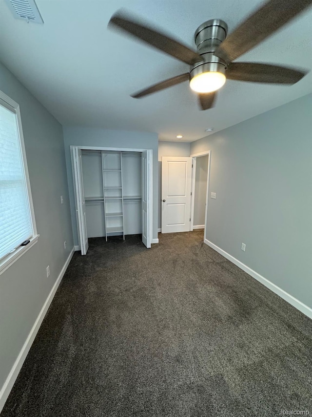 677 King Cir, Lake Orion, MI 48362 - unfurnished bedroom featuring dark carpet, a closet, a ceiling fan, and recessed lighting