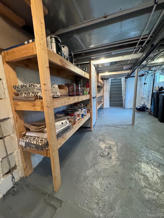 677 King Cir, Lake Orion, MI 48362 - unfinished below grade area with stairs and a water softener