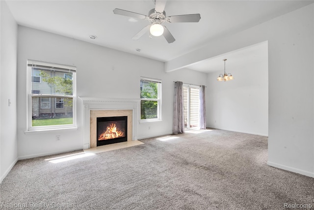 1236 University Dr, Pontiac, MI 48342 - unfurnished living room with carpet, a premium fireplace, a chandelier, and a ceiling fan