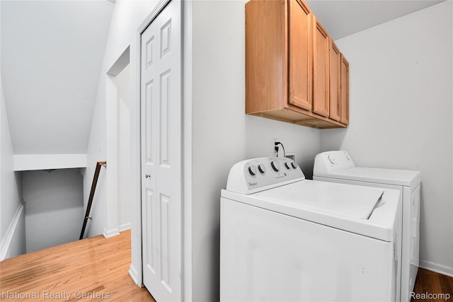 1236 University Dr, Pontiac, MI 48342 - washroom with washer and dryer, wood finished floors, and cabinet space