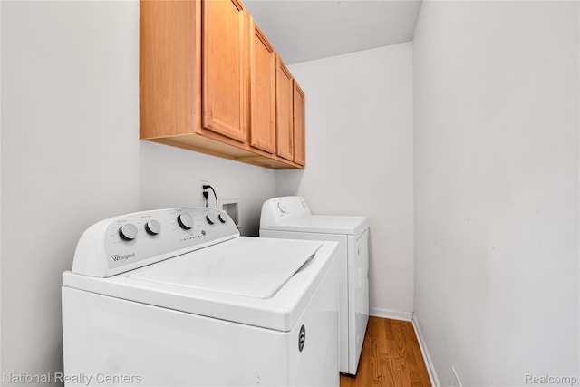 1236 University Dr, Pontiac, MI 48342 - laundry room featuring cabinet space, separate washer and dryer, and light wood-style flooring