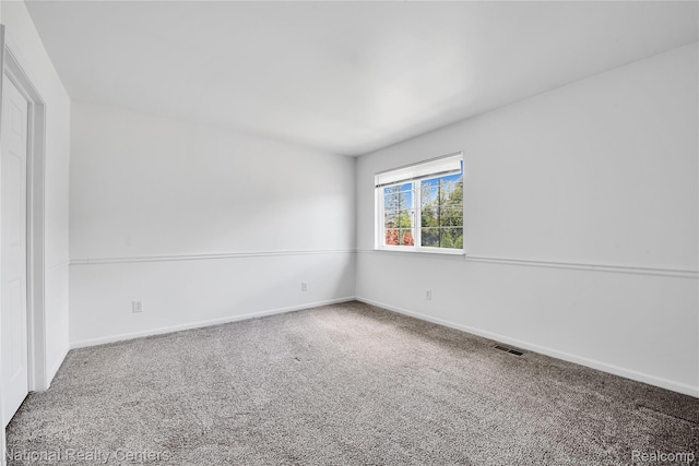 1236 University Dr, Pontiac, MI 48342 - carpeted spare room featuring baseboards