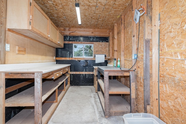 5010 N Pendell Rd, Alma, MI 48801 - miscellaneous room featuring a workshop area and concrete floors