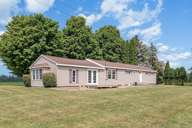 5010 N Pendell Rd, Alma, MI 48801 - view of front facade featuring french doors and a front lawn