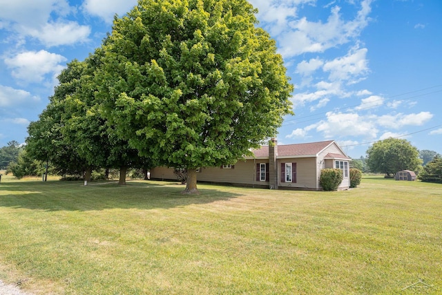 5010 N Pendell Rd, Alma, MI 48801 - view of grassy yard featuring a storage unit