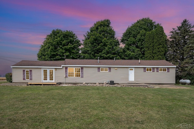 5010 N Pendell Rd, Alma, MI 48801 - view of front facade with a lawn and french doors