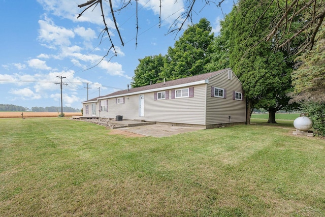 5010 N Pendell Rd, Alma, MI 48801 - rear view of property with a patio and a yard