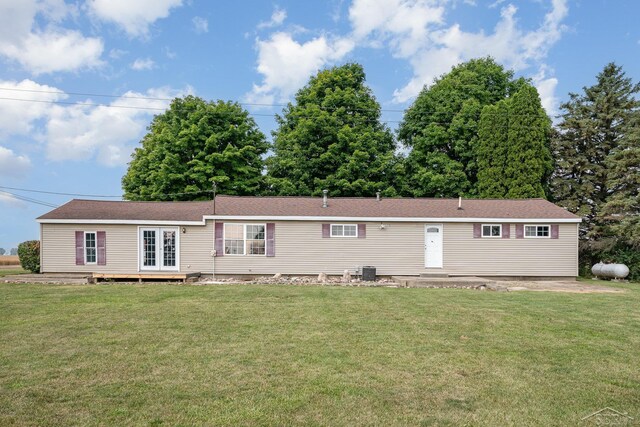 5010 N Pendell Rd, Alma, MI 48801 - view of front facade with a front lawn and french doors