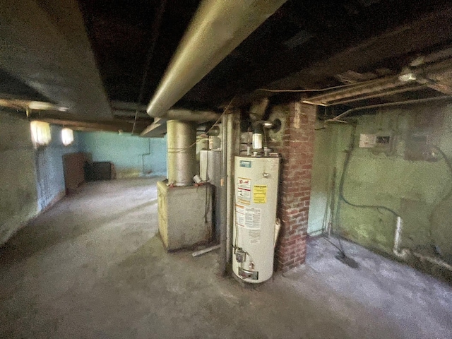 262 5th St, Manistee, MI 49660 - unfinished basement featuring gas water heater and heating unit