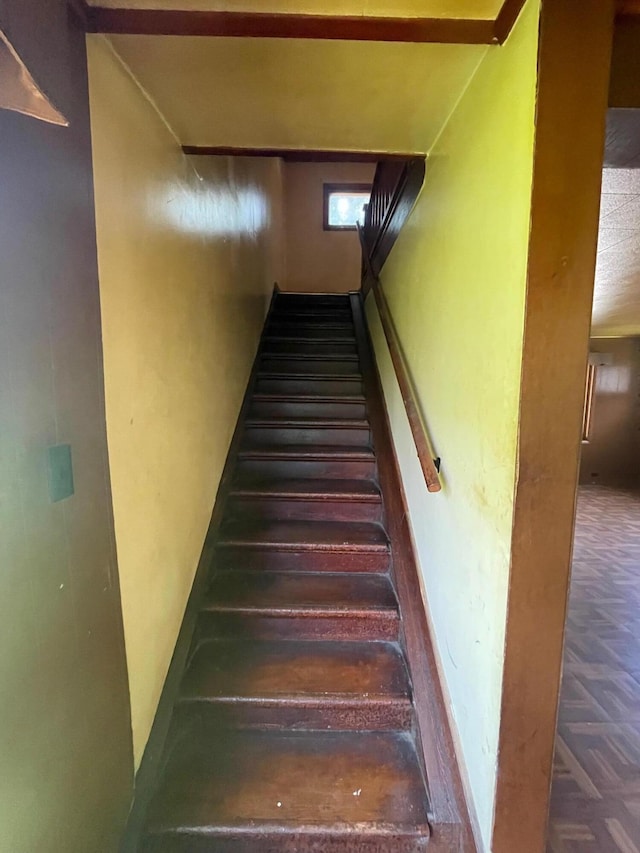 262 5th St, Manistee, MI 49660 - staircase featuring baseboards