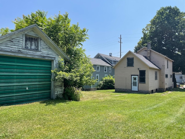 262 5th St, Manistee, MI 49660 - view of green lawn with an outdoor structure