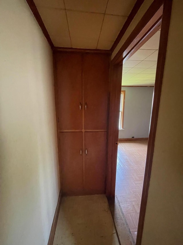 262 5th St, Manistee, MI 49660 - hallway featuring baseboards and a drop ceiling
