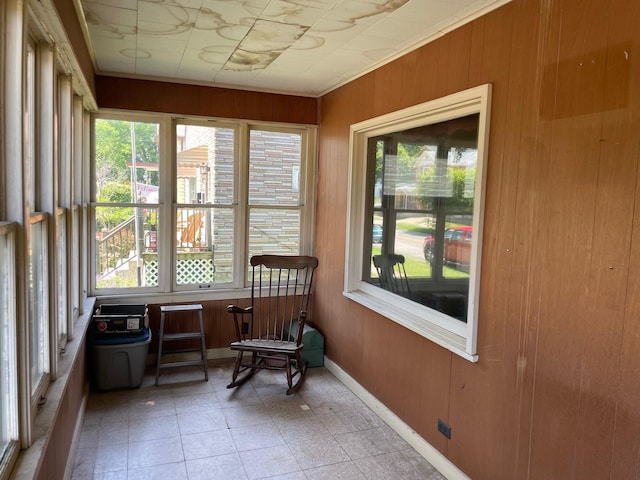 262 5th St, Manistee, MI 49660 - sunroom featuring wooden walls and healthy amount of natural light