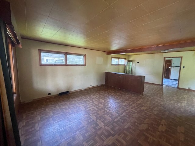 262 5th St, Manistee, MI 49660 - unfurnished living room featuring baseboards