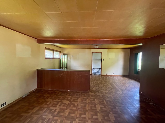 262 5th St, Manistee, MI 49660 - kitchen featuring baseboards and a peninsula