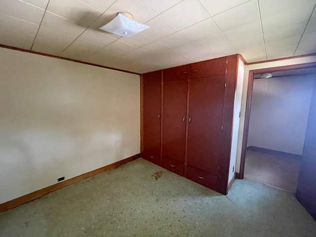 262 5th St, Manistee, MI 49660 - unfurnished bedroom featuring ornamental molding and a closet