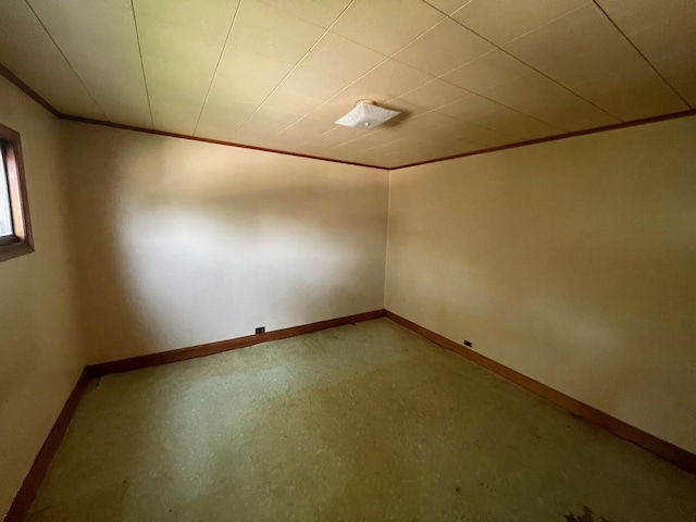 262 5th St, Manistee, MI 49660 - unfurnished room with baseboards and crown molding