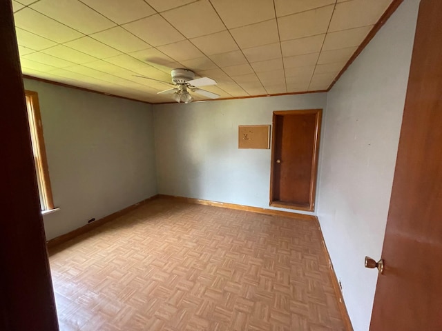 262 5th St, Manistee, MI 49660 - spare room with ceiling fan and crown molding